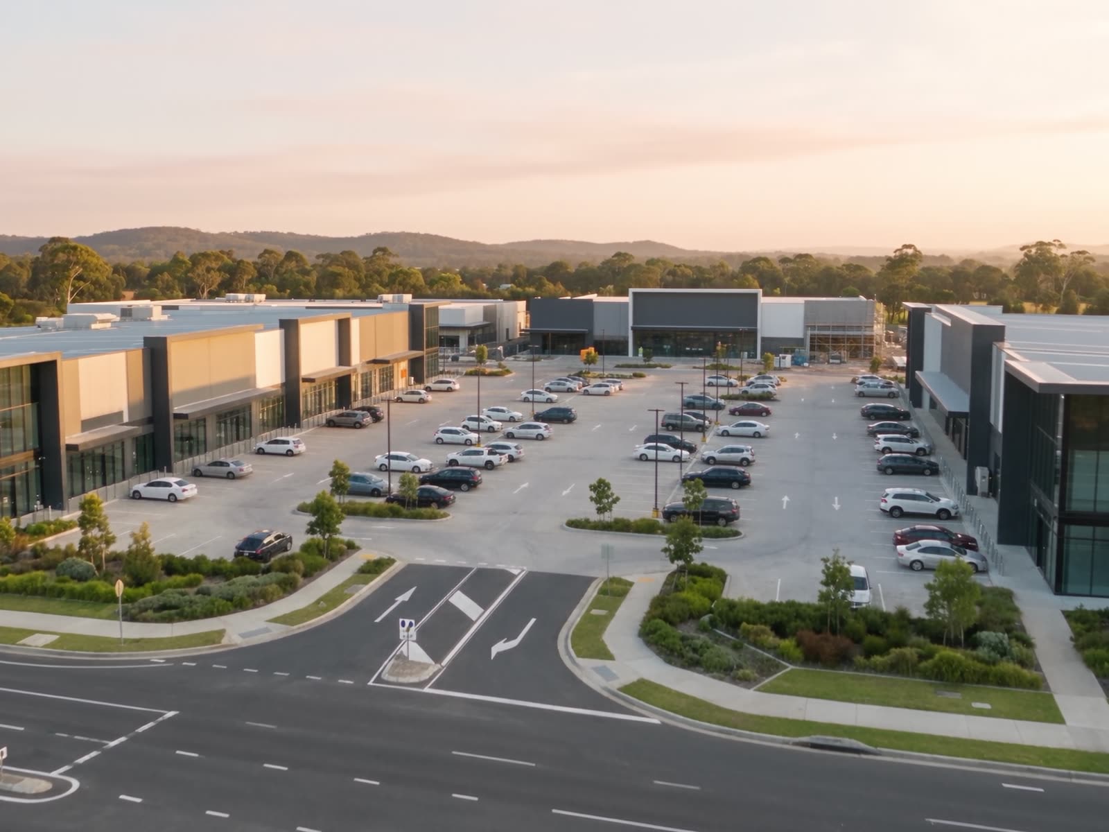 Large-format retail at golden hour — rooftop and carpark